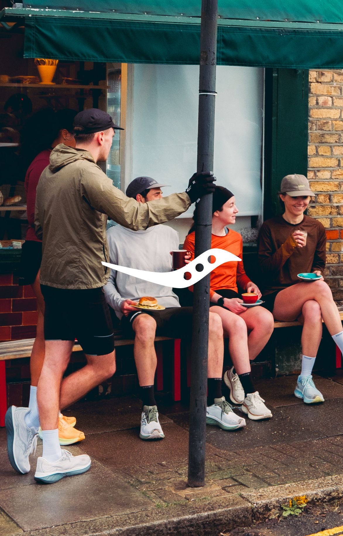 Man and woman running on the sidewalk